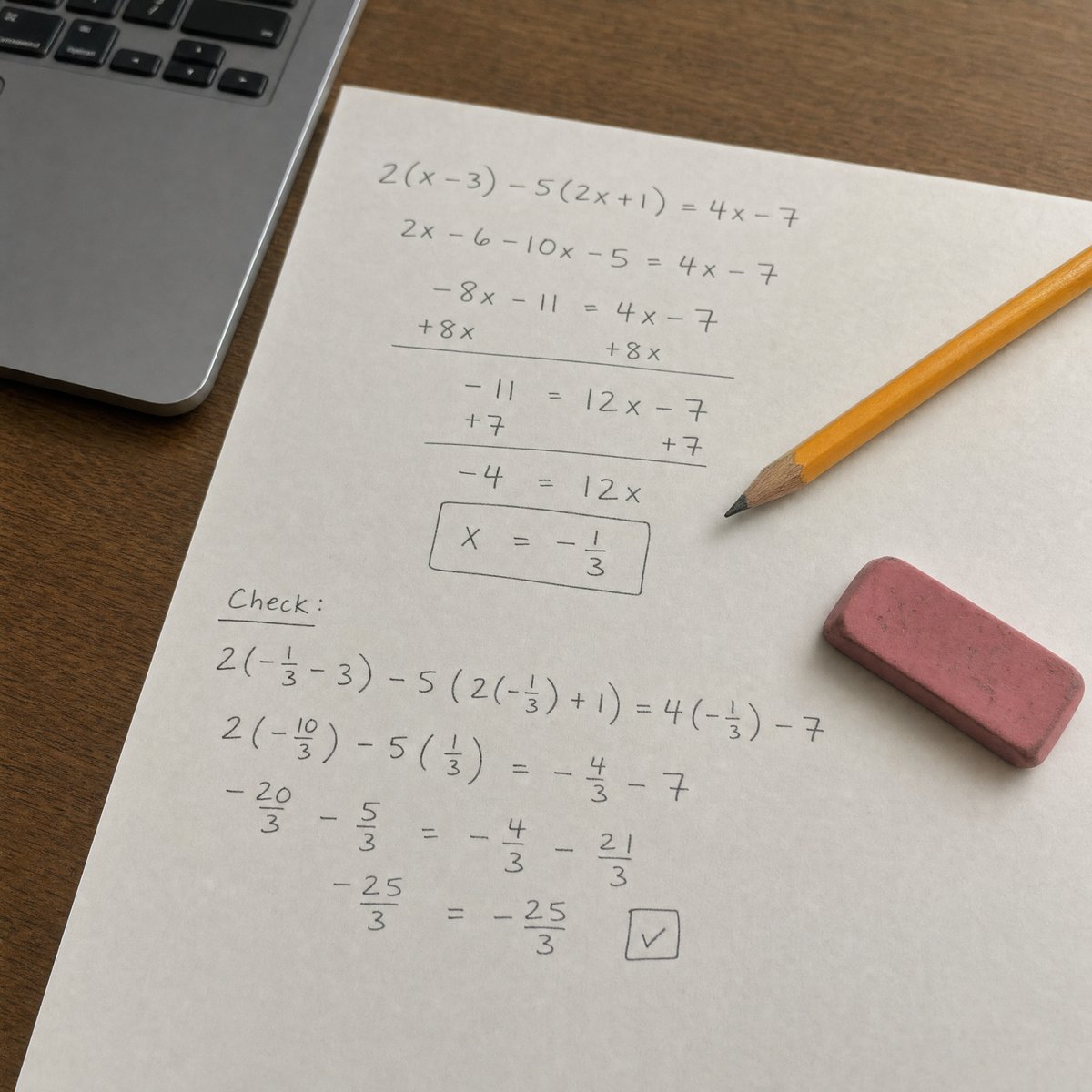 Scratch paper with a worked SAT algebra problem beside a laptop